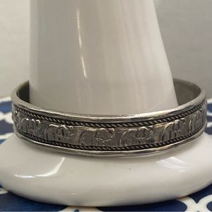 Vintage silver plated tone women elephant etched cuff bracelet. Used.